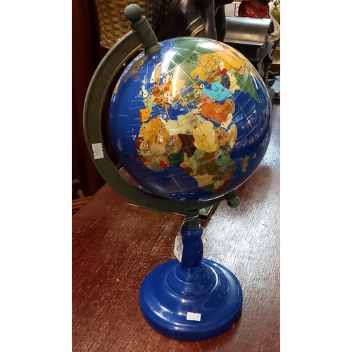 58 - A modern gem globe on ceramic moulded circular base.  (B.P. 21% + VAT)