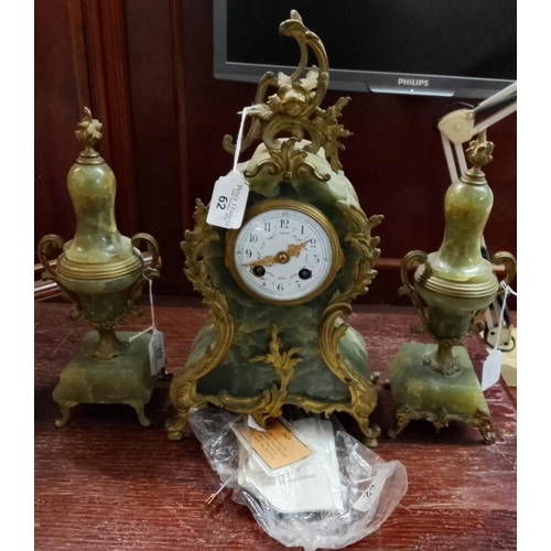 62 - A French eight day onyx clock garniture set in Rococo style with gilded ormolu mounts, key and pendu... 