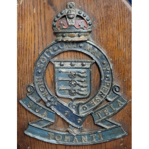 121 - Cast iron Royal Army Ordnance Corps Railway badge mounted on oak plaque. 42x31cm overall.  (B.P. 21%... 