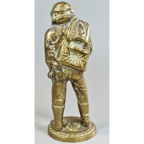 2 - Cast brass figure of an RAF Battle of Britain Fighter Pilot, with RAF crest to the circular gadroon ... 