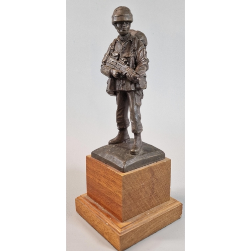 23 - After Brian Elton, bronzed full length figure of a British Army Paratrooper in full battle dress wit... 