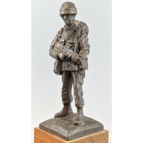 23 - After Brian Elton, bronzed full length figure of a British Army Paratrooper in full battle dress wit... 