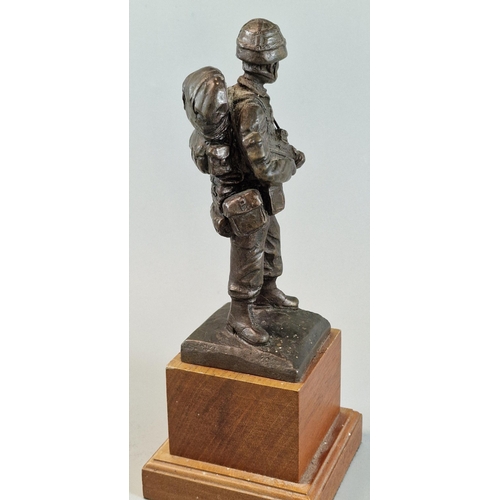 23 - After Brian Elton, bronzed full length figure of a British Army Paratrooper in full battle dress wit... 