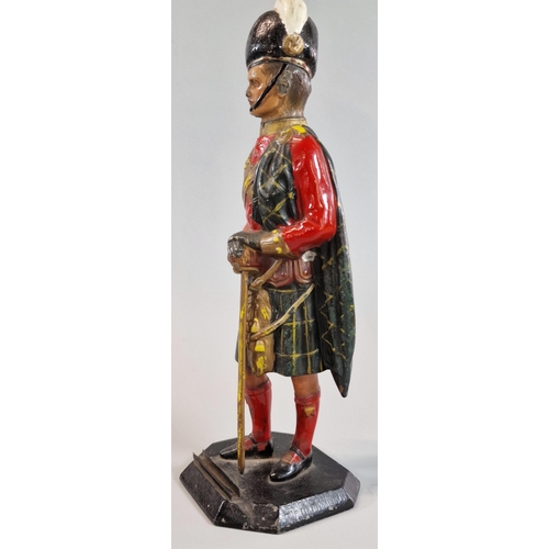 26 - Cold painted spelter full length figure of a Scottish Army Officer in dress uniform. Octagonal base.... 