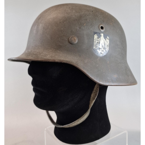 300 - German Third Reich M40 single decal army helmet with leather liner (marked 'E.H.G') and chinstrap. H... 