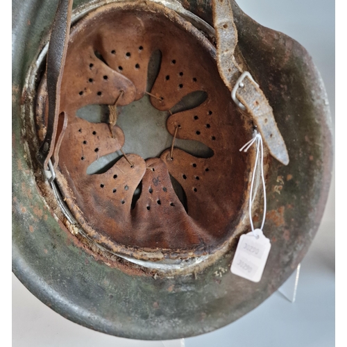 302 - German Third Reich M42 single decal helmet, with leather liner and chinstrap. Unclear markings stamp... 