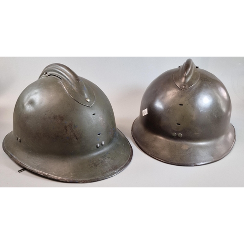 319 - Two French Adrian M26 helmets. Green helmet with liner and chinstrap (size 55). Marked 'Carpentier' ... 