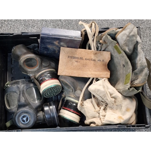 327 - Box containing two WWII period and one British Army S6 gas masks with satchels. (B.P. 21% + VAT)