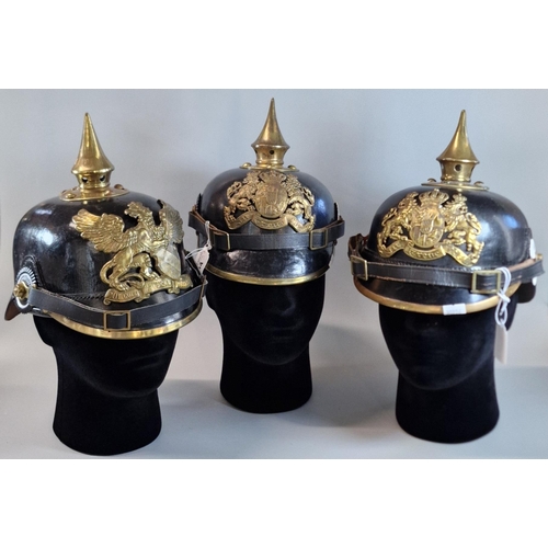 54 - Group of three reproduction Imperial German Pickelhaube leather and brass mounted Officer's dress he... 