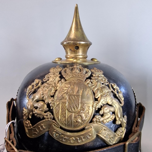 54 - Group of three reproduction Imperial German Pickelhaube leather and brass mounted Officer's dress he... 