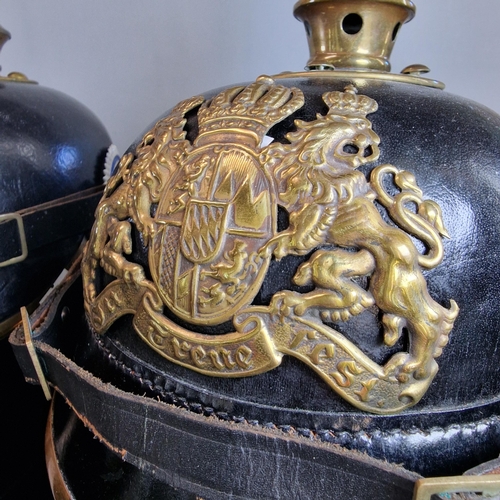 54 - Group of three reproduction Imperial German Pickelhaube leather and brass mounted Officer's dress he... 