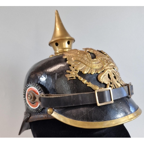 59 - Imperial German leather and brass Pickelhaube Officer's helmet with brass Imperial Eagle motif. Inte... 