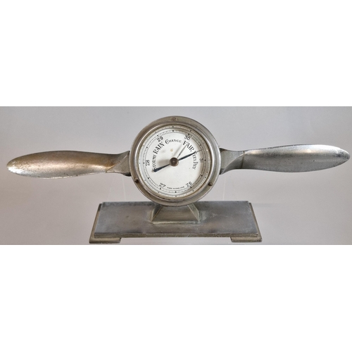 8 - British made white metal desk top barometer in the form of a propeller, on rectangular stand. 29.5cm... 