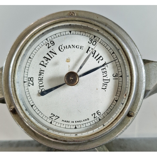 8 - British made white metal desk top barometer in the form of a propeller, on rectangular stand. 29.5cm... 