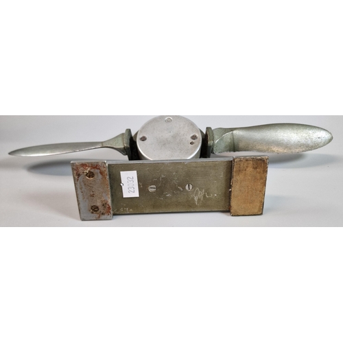 8 - British made white metal desk top barometer in the form of a propeller, on rectangular stand. 29.5cm... 