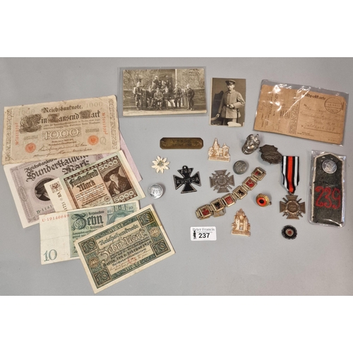 237 - Group of WWI related items of insignia, ephemera, photographs to include postcard featuring German s... 