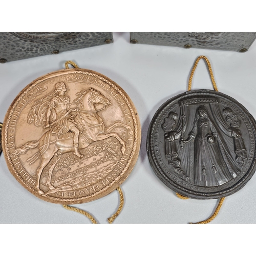 137 - Two replica Royal seals, two reproduction brass miliary armorials, possibly from Shako plates and a ... 