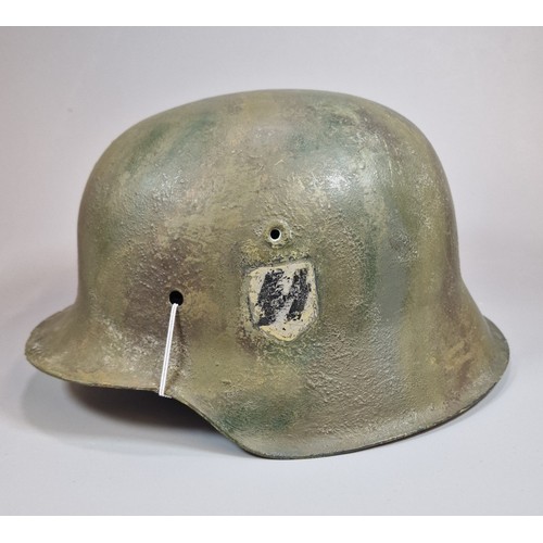 324 - German M42 helmet stamped 'ET64' and '1650' to interior rim. No liner. No chinstrap. Modern paint an... 