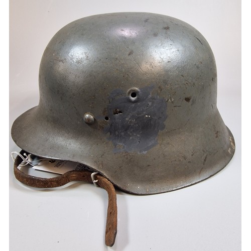 325 - German M42 helmet WWII period. Marked 'EF64' and '473'. With chinstrap and liner. (B.P. 21% + VAT)