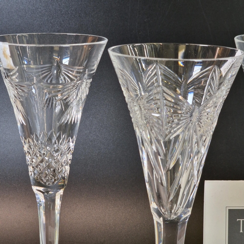 15 - A set of four Waterford crystal 'The Millennium Collection' toasting glasses for the year 2000. (4) ... 