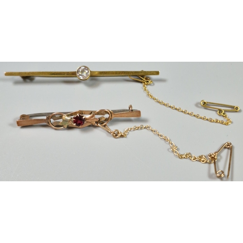 215 - Edwardian 9ct gold and ruby bar brooch. 1.6g approx. Together with another 9ct gold and blue stone b... 