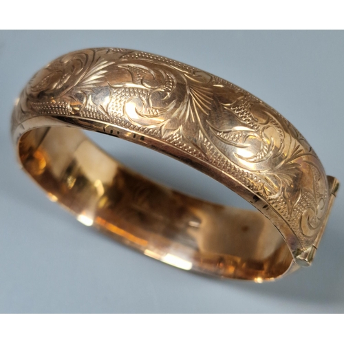 223 - 9ct rose gold engraved bangle. 26g approx. (B.P. 21% + VAT)