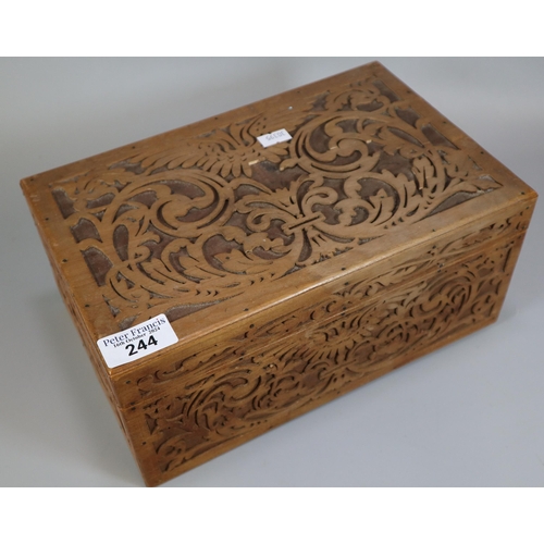 244 - A wooden carved fretwork box, the interior revealing assorted items to particularly include: various... 