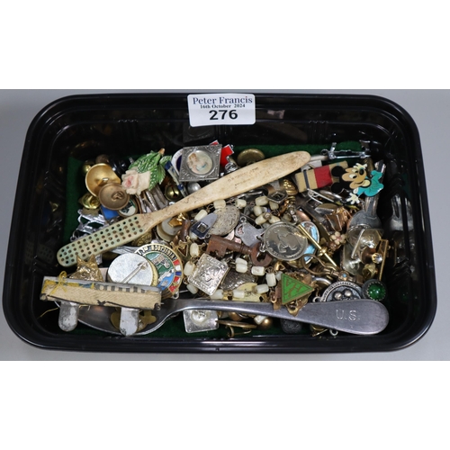 274 - A plastic tub of oddments to include: enamel badges, military items, penknife, medallions, etc. (B.P... 