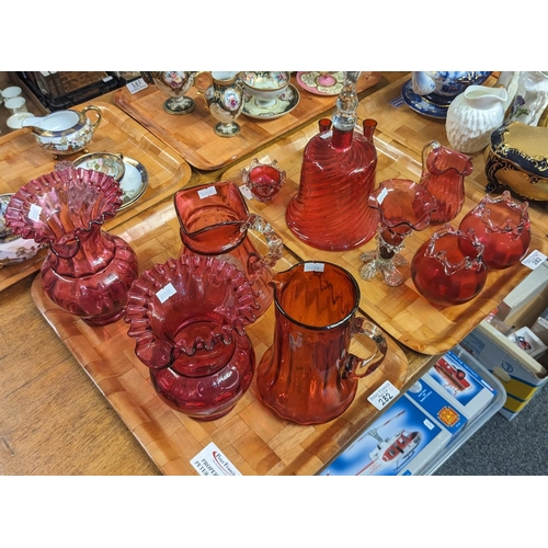 282 - Two trays of mainly Victorian Cranberry glass items to include: Wrythen bell, pair of jugs and other... 