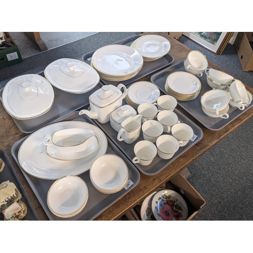 299 - Five trays of Royal Doulton English fine bone china 'Gold Concord' tea and dinnerware items. (5) (B.... 