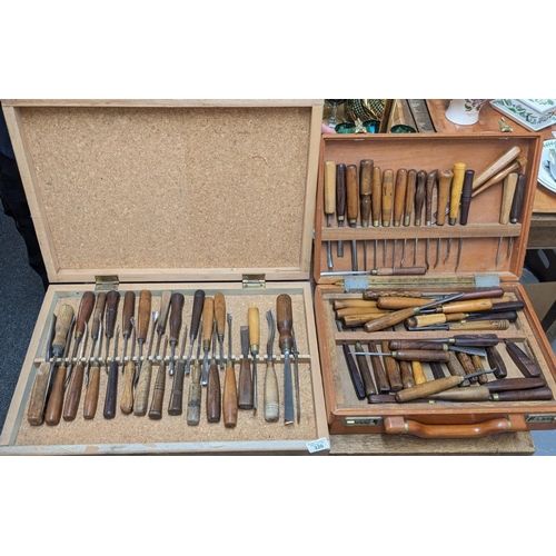 320 - Large collection of wood turners chisels of varying form and size all with turned wooden handles, ma... 