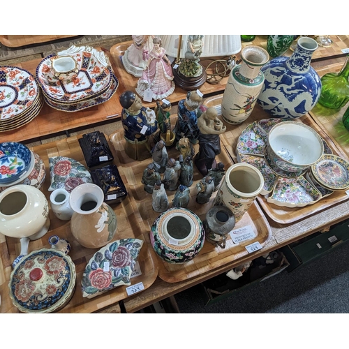 323 - Three trays of mainly Oriental items: crackle glaze warrior vase, blue and white flask vase decorate... 