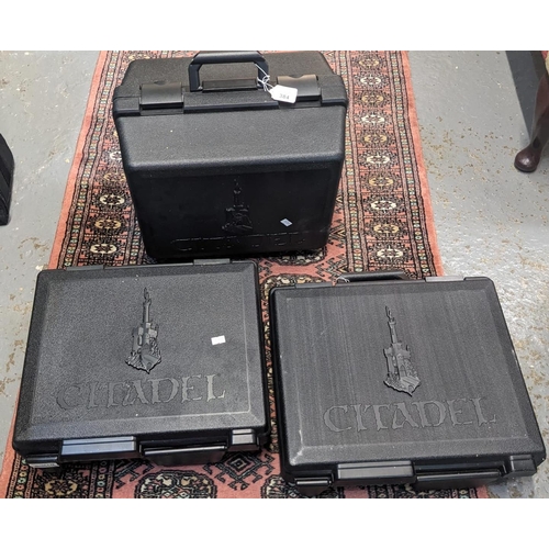 384 - Three Citadel plastic carrying cases. (3) (B.P. 21% + VAT)