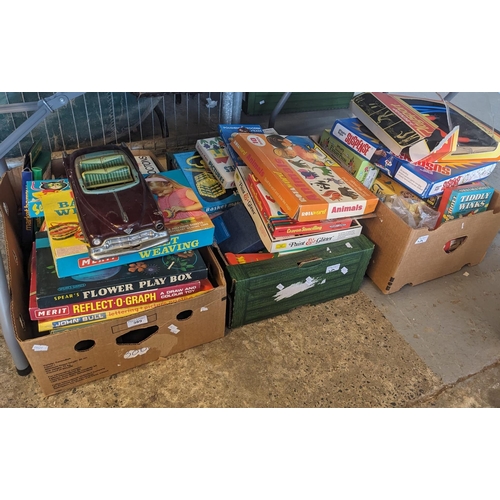 389 - Three boxes of assorted vintage and other games. A Japanese tin-plate car, Merit basket weaving, cra... 