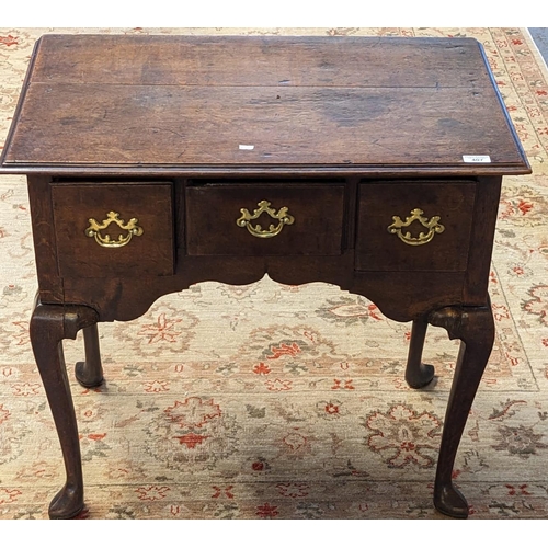 407 - 18th century style oak lowboy, the moulded top above three drawers, shaped frieze with cabriole legs... 