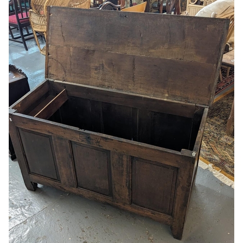 409 - 18th century oak coffer, the moulded and hinged top with fitted candle box to the interior. Carved i... 