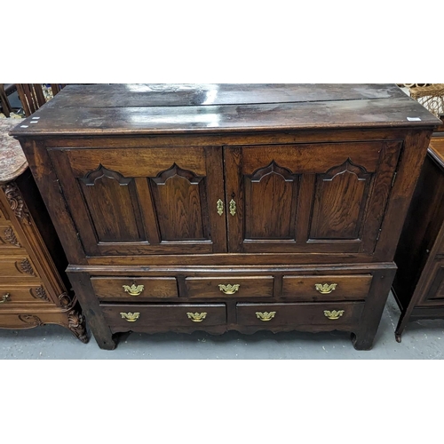 411 - 18th century Cardiganshire oak mule chest, the moulded top above four pointed ogee panels, the proje... 