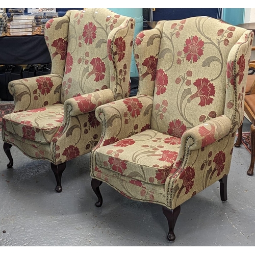 418 - Pair of upholstered floral and foliate wing chairs on cabriole front legs. (2) (B.P. 21% + VAT)