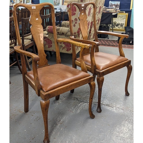 419 - A pair of Queen Anne style oak splat back dining armchairs with drop-in seats on cabriole legs. (2) ... 