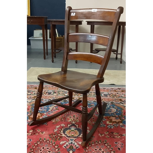 435 - Late 19th / early 20th century elm bar-back rocking chair. (B.P. 21% + VAT)