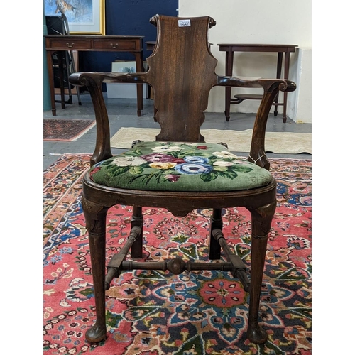 449A - 18th century style mahogany scrolled splat back elbow chair with bow fronted cane seat on moulded ca... 