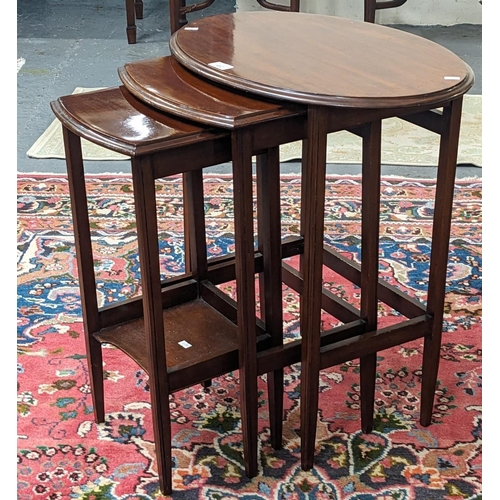 452 - Edwardian mahogany nest of three oval tables. (B.P. 21% + VAT)