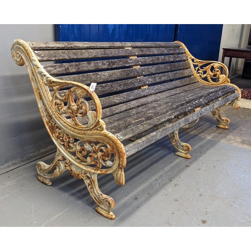 455 - Heavy cast iron scrolled foliate design garden bench with centre cast iron support and wooden slats.... 