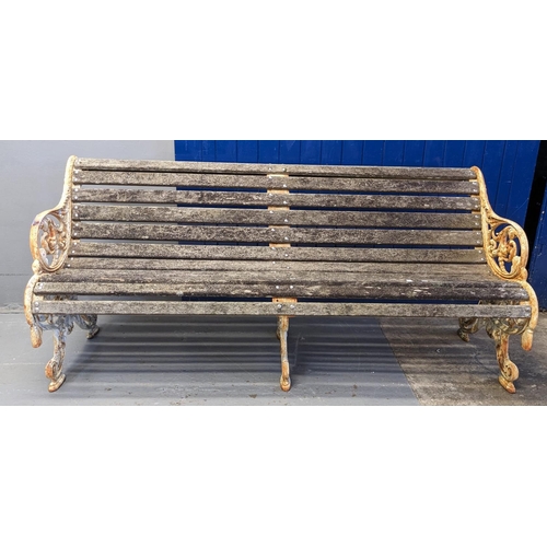 455 - Heavy cast iron scrolled foliate design garden bench with centre cast iron support and wooden slats.... 