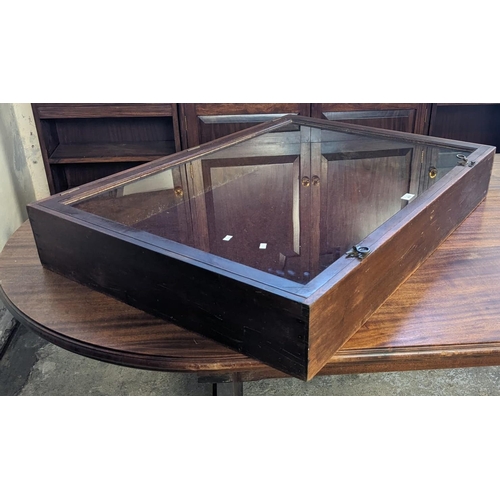 459 - Mahogany table top display case with hinged top having brass catches and later odd carrying handles.... 