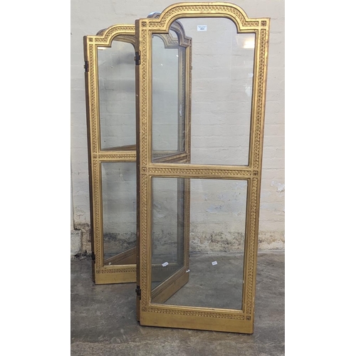 463 - 19th century gilt gesso framed four section glazed folding screen. Each section 53cm wide x 148cm hi... 