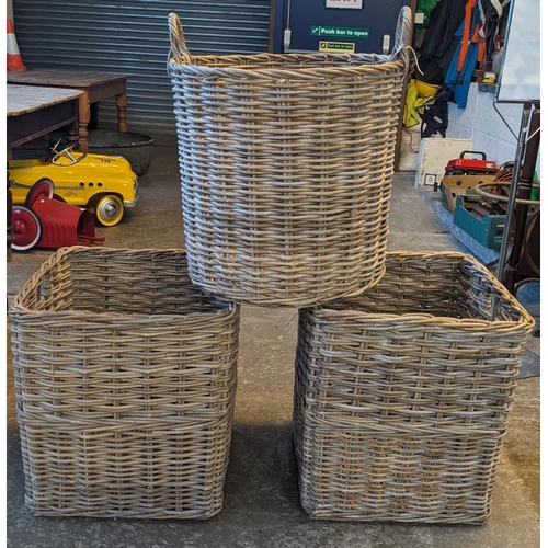 475 - Pair of similar square cane log baskets. 52cm square by 56cm high approx. Together with a circular c... 