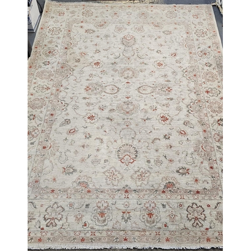 486 - Large Middle Eastern design cream ground floral and foliate carpet. 342 x 246cm approx. Together wit... 