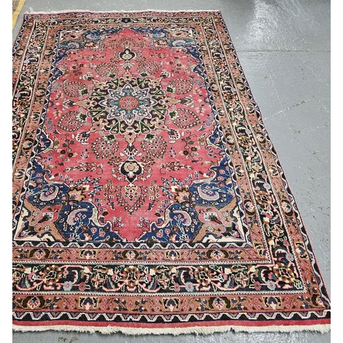 492 - Vintage Persian Heriz red ground floral and foliate carpet. 295 x 201cm approx. (B.P. 21% + VAT)