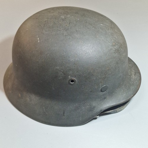 302 - German Third Reich M42 single decal helmet, with leather liner and chinstrap. Unclear markings stamp... 